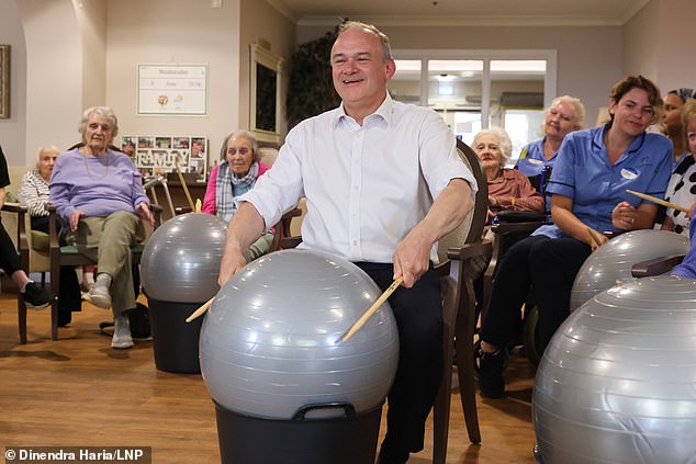 Meme account Insane Moments in British Politics shared clips of Davey singing We Will Rock You on a drum kit made from an exercise ball as part of a bizarre photo shoot last week, which alone has 1.9 million views on x.