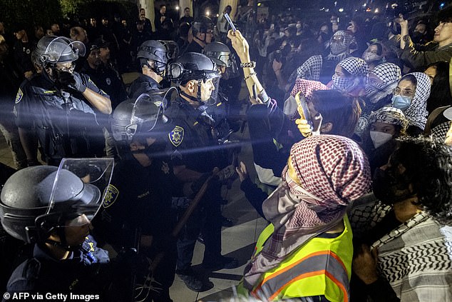 The protest escalated into skirmishes between police and protesters and police said 25 people were arrested around 8pm for refusing to leave.