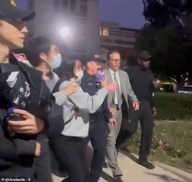 UCLA Vice Chancellor Michael Beck was chased and threatened by a crowd of protesters as a squad of police escorted him across campus.