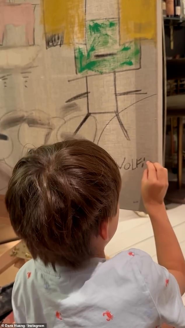 In the clip, Wolfie could be seen excitedly creating his own piece of art while his mother made hers on a separate canvas.