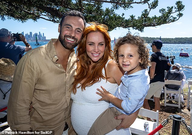 It comes after Robinson, 42, revealed her debilitating battle with premenstrual dysphoric disorder (PMDD) as she prepares to welcome her second child with husband Cameron Merchant. (LR: Jules, Cameron and their son Ollie, four)