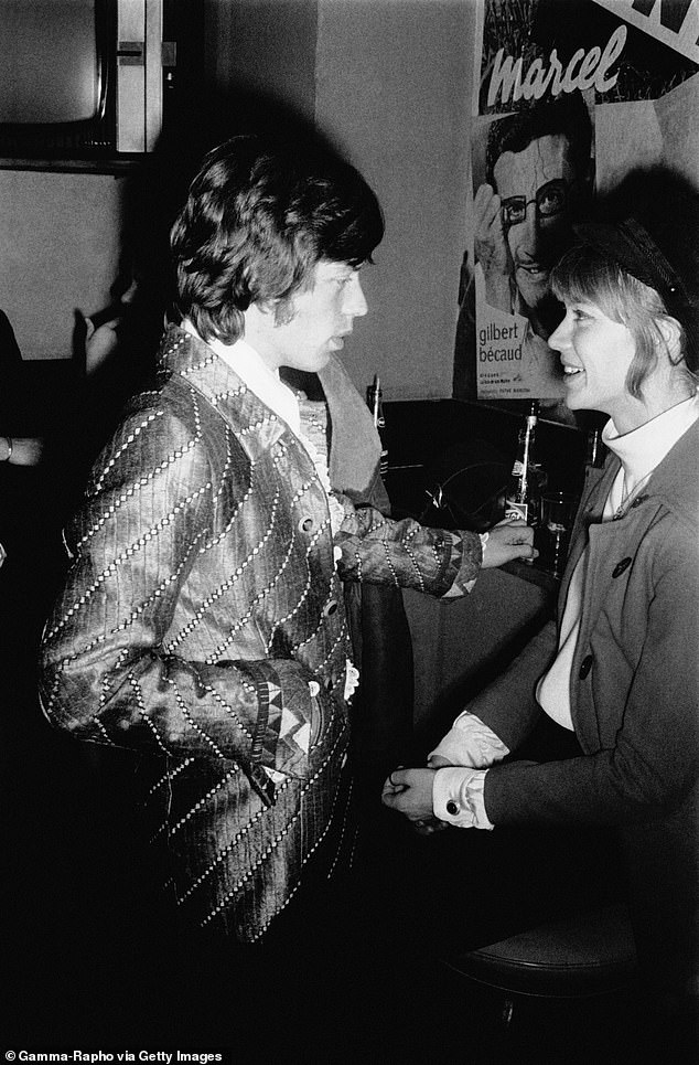 Hardy rubbing shoulders with Mick Jagger in 1967 (pictured)