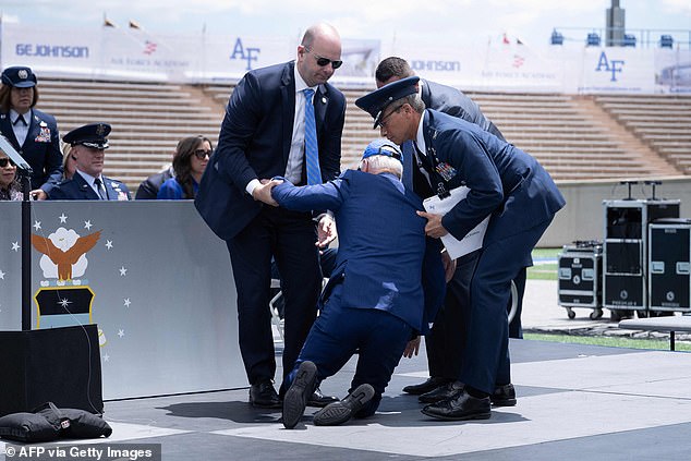 Joe Biden is helped up after falling during the graduation ceremony at the United States Air Force Academy in Colorado on June 1, 2023.