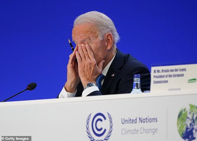 Biden rubs his eyes during