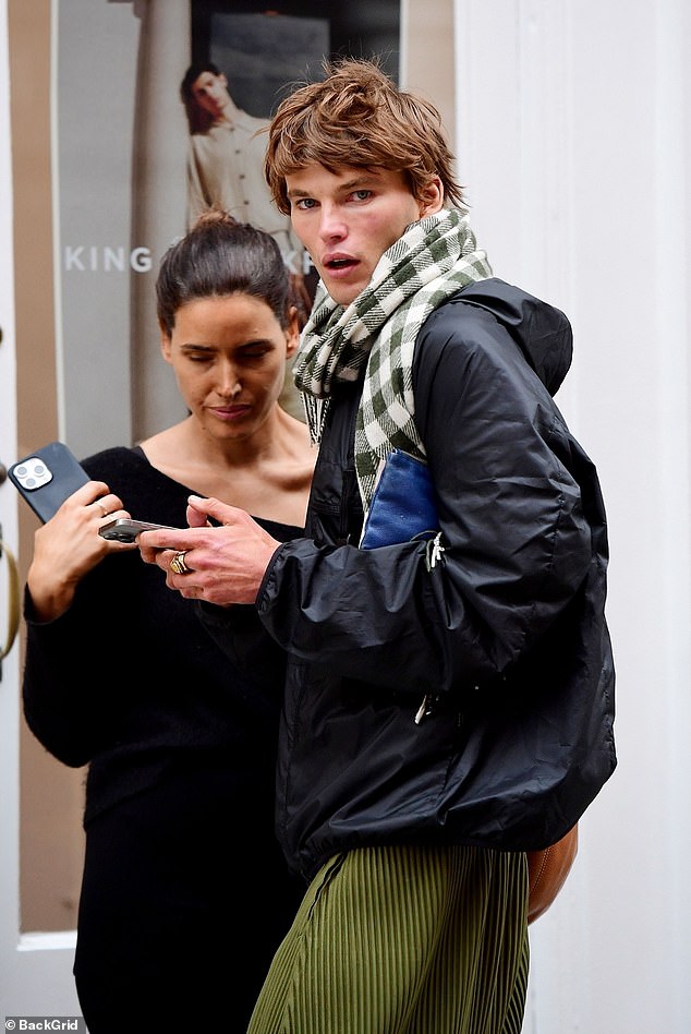 Showing off her natural beauty, the brunette removed her makeup and put her hair up in a simple ballerina bun.