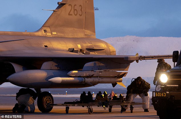 A Swedish aircrew prepares a JAS Gripen fighter jet for takeoff at Kallax Air Base, Sweden, March 4, 2024.