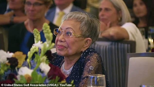 The camera focused on Tida, 80, as she emotionally looked at her son on the podium.