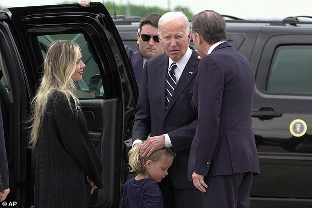 President Joe Biden (center) stayed courtside to speak with Melissa Cohen (left), baby Beau (center) and Hunter Biden (right) after Hunter's sentencing.