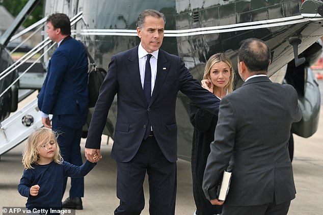 Hunter Biden (center) and Melissa Cohen (right) greet a White House aide as they walked to separate vehicles with their son Beau (left).