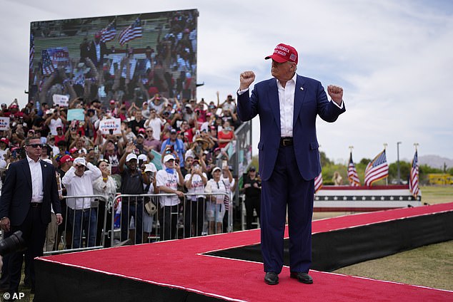 Republican presidential candidate Former President Donald Trump gestures as he takes the stage at a campaign rally, June 9, 2024, in Las Vegas.