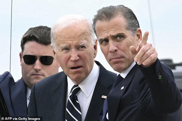 U.S. President Joe Biden speaks with his son Hunter Biden upon arrival at the Delaware Air National Guard Base in New Castle, Delaware, June 11, 2024.