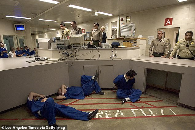 Understaffed and overcrowded, the Los Angeles County prison system, the largest in the country, houses nearly 200,000 inmates a year and polices a population that averages 18,000 a day. Upstairs, in a crowded reception center, inmates sleep on the floor as they wait to be processed for the Men's Central Jail in the Twin Towers in downtown Los Angeles.