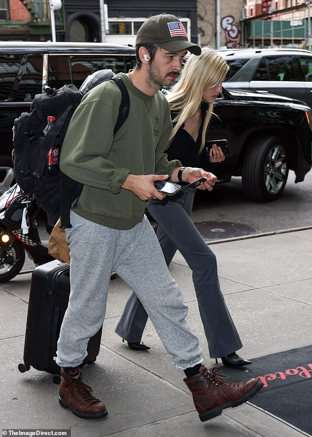 Matty cut a casual figure in a khaki green jumper and gray joggers, while his wife-to-be looked chic in bootcut pants and heeled boots.