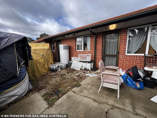 The house was strewn with rubble on Wednesday (pictured)