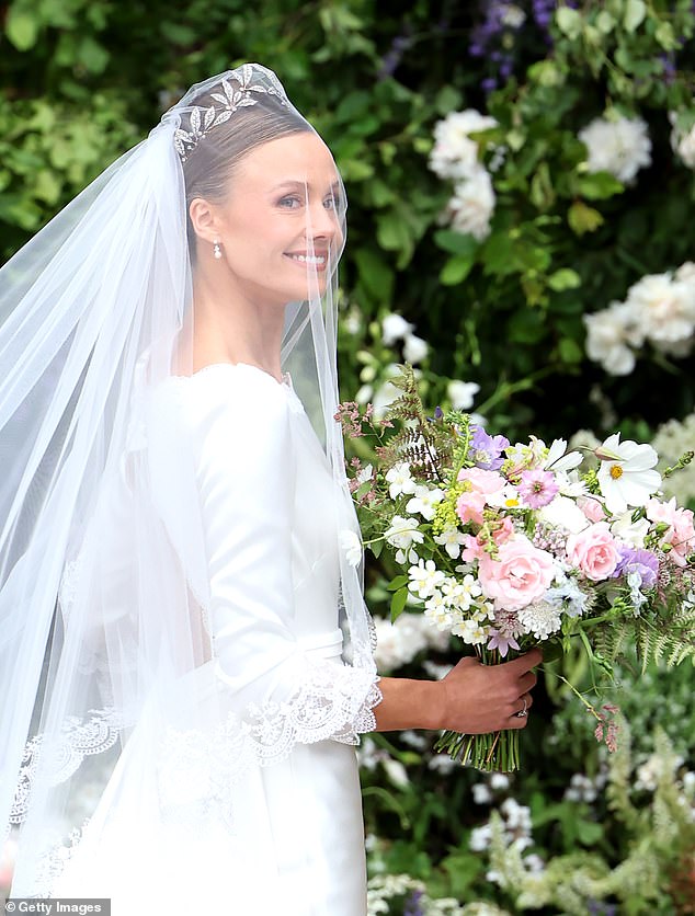 Olivia looked every inch the duchess in her custom-made vintage-style wedding dress.