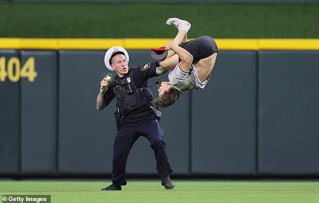 Wearing a Johnny Bench T-shirt, the man executed a perfect backflip as an officer approached.