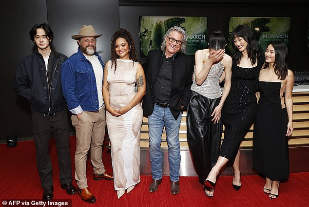 Russell, pictured with his co-stars at Saturday's event, plays the older version of former U.S. Army Colonel Lee Shaw in the popular Apple TV+ series.