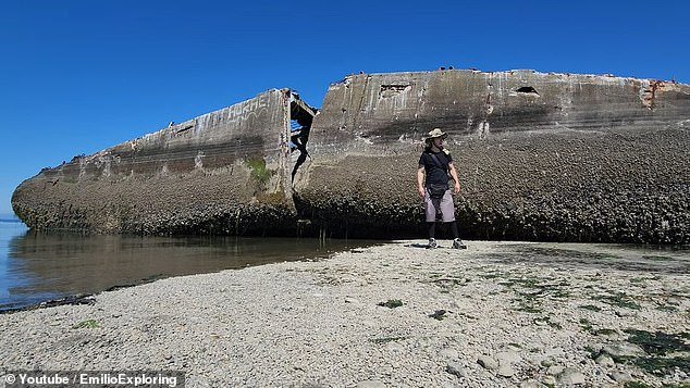 Split into two pieces after decades of pounding in the waters of the Nisqually Reach, the massive hull still attracts curious tourists who can walk up to it at low tide.