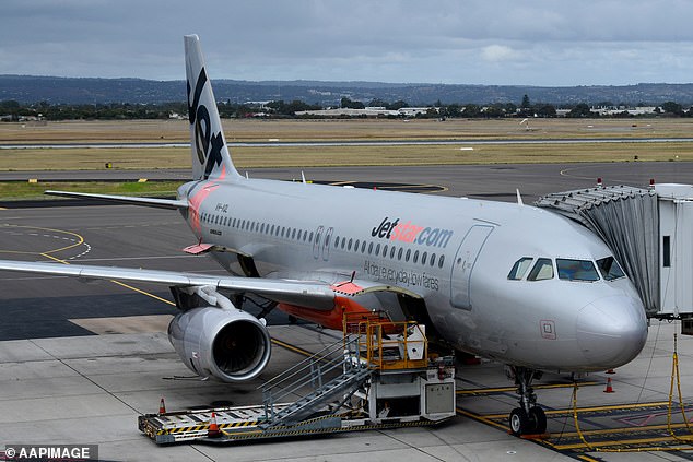 Elly Hudson had just returned from her holiday in Bali on Monday when she discovered her clothes were soaked and discolored by streaks of dye in the fabric (pictured, a Jetstar plane in Adelaide).