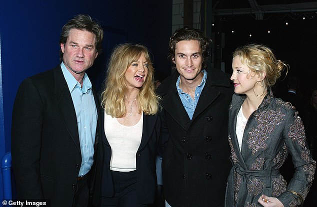 Hawn shares Kate, 45, and Oliver, 47, with ex-husband Bill Hudson, and is mother to son Wyatt Russell, 37, with partner Kurt Russell; Kurt, Goldie, Oliver and Kate seen in 2003