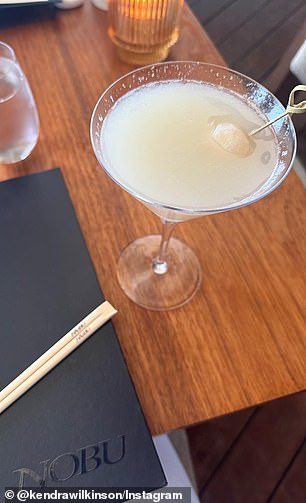 She also shared her cocktail, which appeared to be a lychee martini.