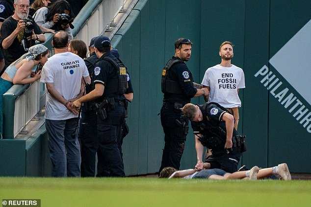 The group, from Climate Defiance, wore t-shirts that said 