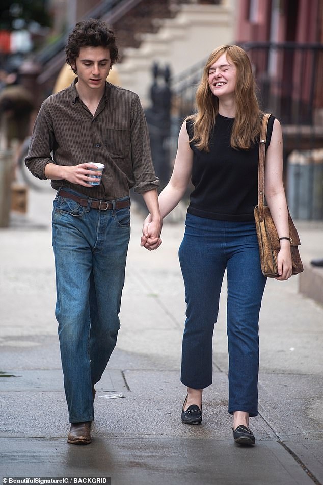 Elle was dressed casually in a black sleeveless sweater. She was wearing a set of dark blue high-waisted jeans and black loafers while she carried a well-worn brown purse.