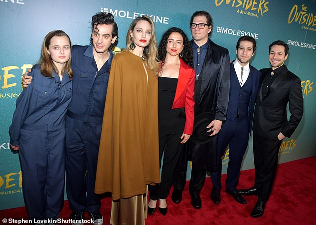 Her daughter Vivienne (left) included her name as 'Vivienne Jolie' in a program for the musical adaptation of The Outsiders, which her mother produced while working as her assistant; seen on April 11 in New York