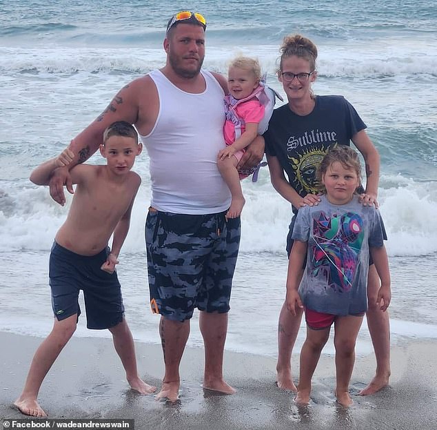 His family said Hunter's mother Diana Ebie (pictured with Hunter on the left, his stepfather Sam Chambers and Hunter's sisters) watched in horror and jumped in to save him.