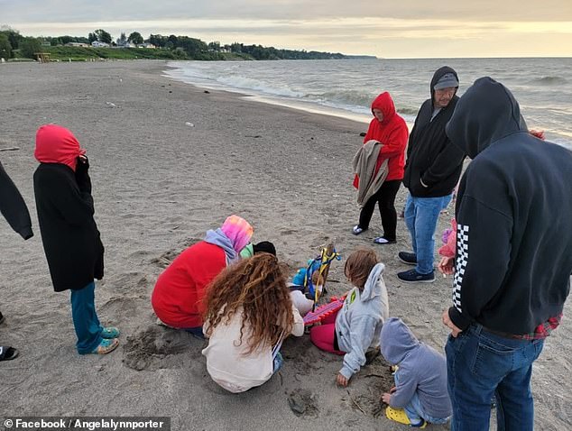 Others stayed on the beach all night with Chambers as she waited for her son to return from the lake.