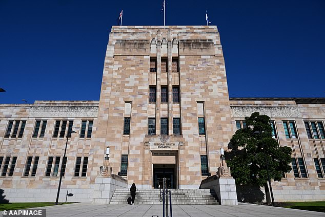 The man faces a total of 165 charges, including 155 counts of observations or recordings violating privacy for allegedly filming women in bathrooms. Pictured is the St. Lucia campus of the University of Queensland.