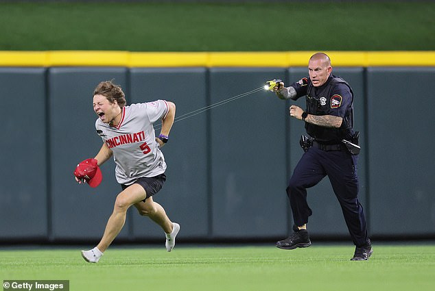 A rowdy Reds fan got the old 'Cincinnati surprise' when he ran onto the field Tuesday night.