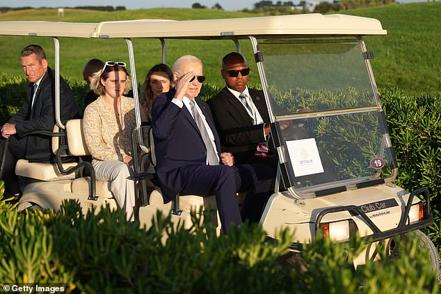 US President Joe Biden joins G7 leaders as they gather to watch a parachute drop at the San Domenico Golf Club during the first day of the 50th G7 summit on June 13, 2024.