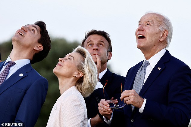 US President Joe Biden, Canadian Prime Minister Justin Trudeau, French President Emmanuel Macron and European Commission President Ursula von der Leyen react during a flag ceremony on the first day of the G7 summit, in Savelletri, Italy , June 13, 2024.