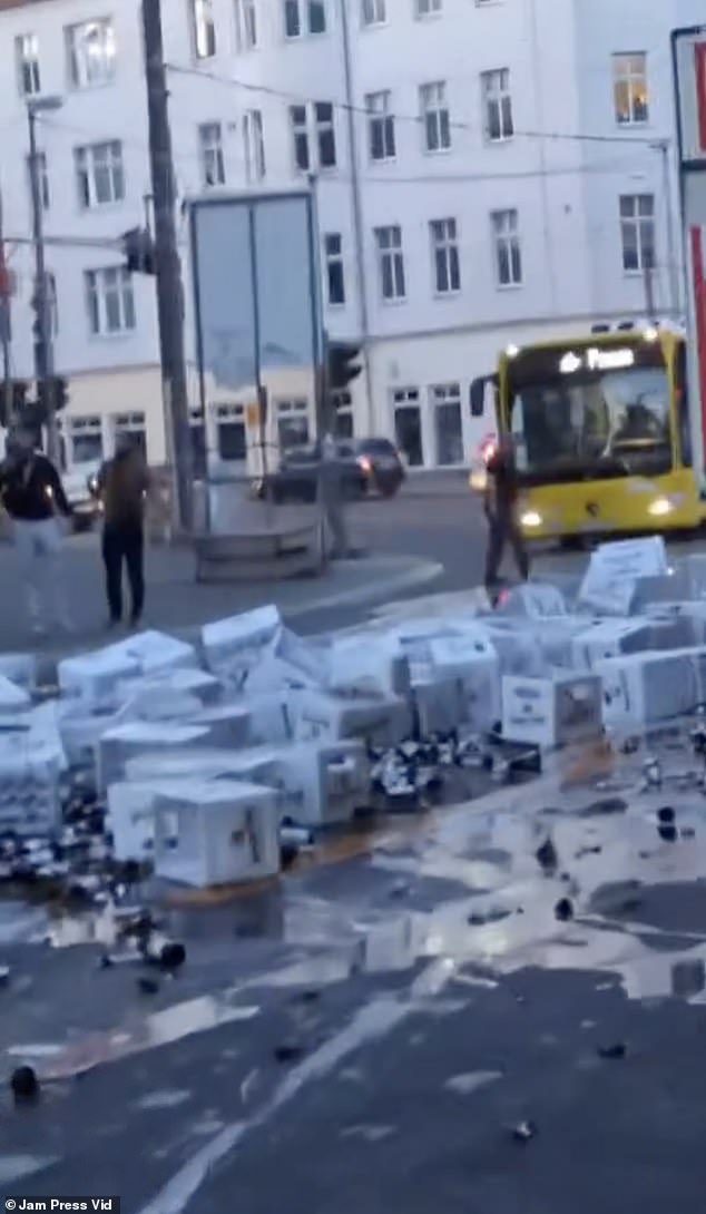 The street was covered in beer, boxes and broken glass.