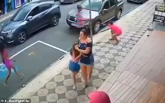 The girl and her mother were left shocked after a stranger abruptly attacked her on a street in Brazil.