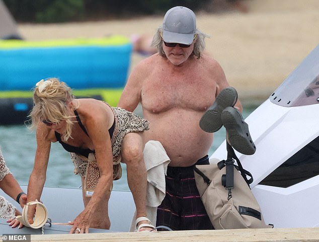 Her attentive companion made sure she boarded the ship safely.