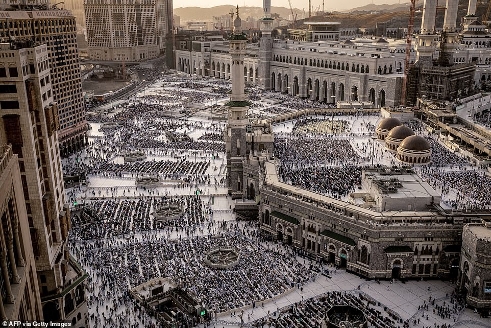 Muslim worshipers walk in the Grand Mosque in the holy city of Mecca, Saudi Arabia.