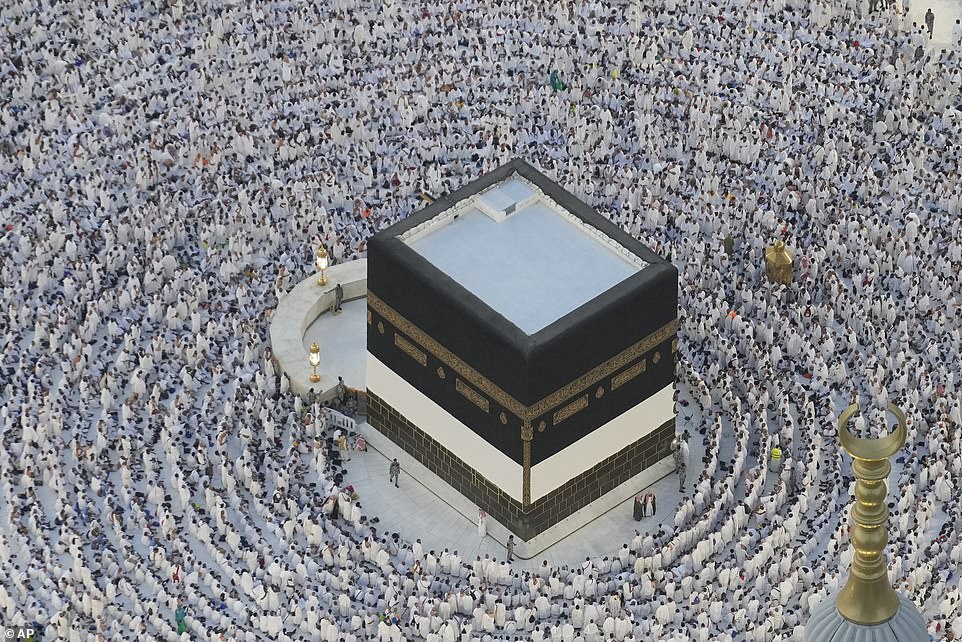 Muslim pilgrims circumambulate the Kaaba, the cubic building of the Great Mosque in Mecca.