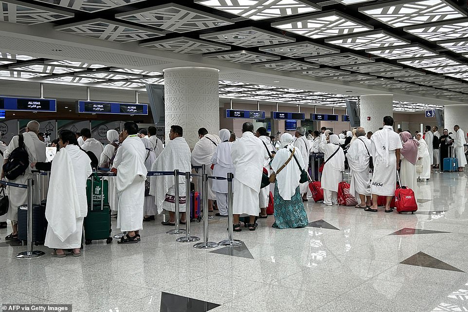 Muslim pilgrims wait to clear immigration after arriving for the annual Muslim pilgrimage to Mecca, at Jeddah International Airport.