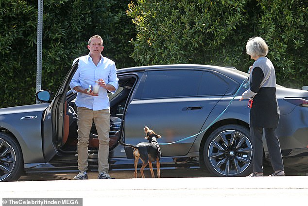 He was seen getting out of his car and meeting his mother while walking her dog.