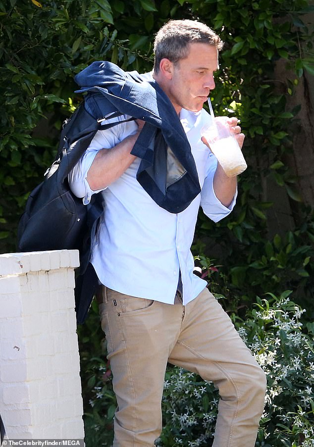 Before entering the rental, he grabbed a backpack and clothes from his car and took them inside.