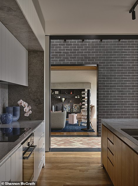 Through the front door, a long hallway takes guests through the original period house to the large communal space that was added to the rear.