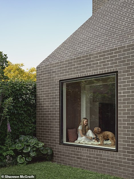 The new owners removed the gray paint covering the terrace's stone front and added its contemporary extension with design elements reflecting the original house to retain its picturesque character.