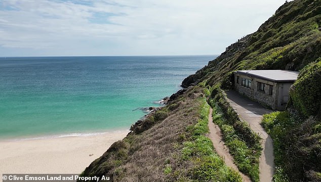 The cliffside cottage is located on the cliffs near the famous Minack Theater and overlooks Porthcurno Beach in Cornwall.