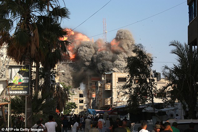 A ball of fire and black smoke rises moments after an Israeli airstrike targeted a residential building in the town of Bureij, central Gaza Strip, on June 3, amid the conflict with Hamas.