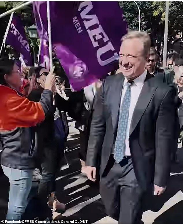 Premier Steven Miles walked past protesters on his way to Parliament to deliver the state budget.