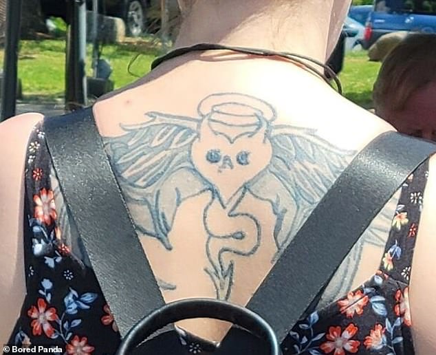 A woman got a tattoo of a cartoon figure of a love heart with angel wings and a devil's tail.