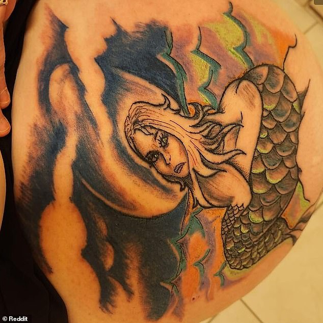 This questionable mermaid tattoo may leave your head spinning because it is not clear what position she is sitting in.