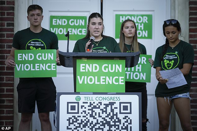 Emma Ehrens (center), a survivor of the 2012 Sandy Hook Elementary School shooting, speaks alongside other survivors during a rally against gun violence last week.